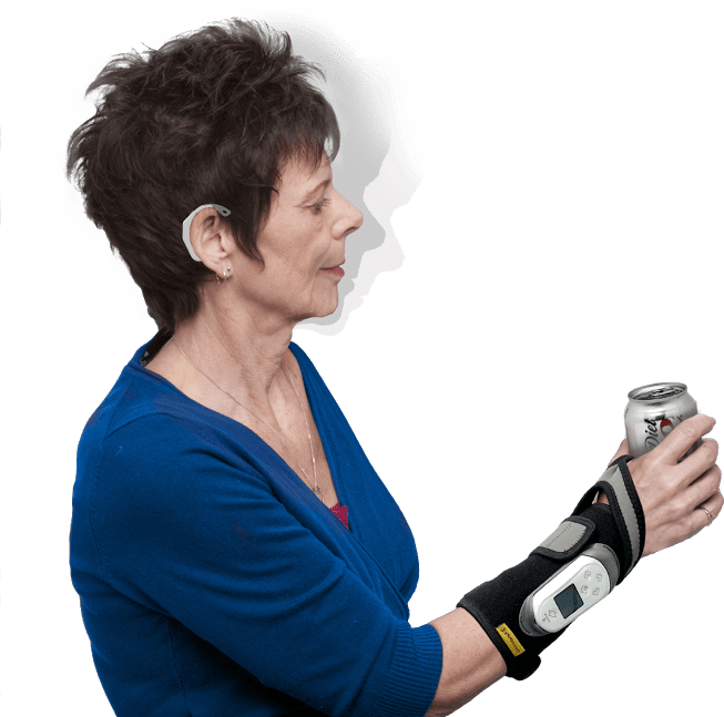 Patient uses ReGrasp Rehabilitation glove to hold a can of pop